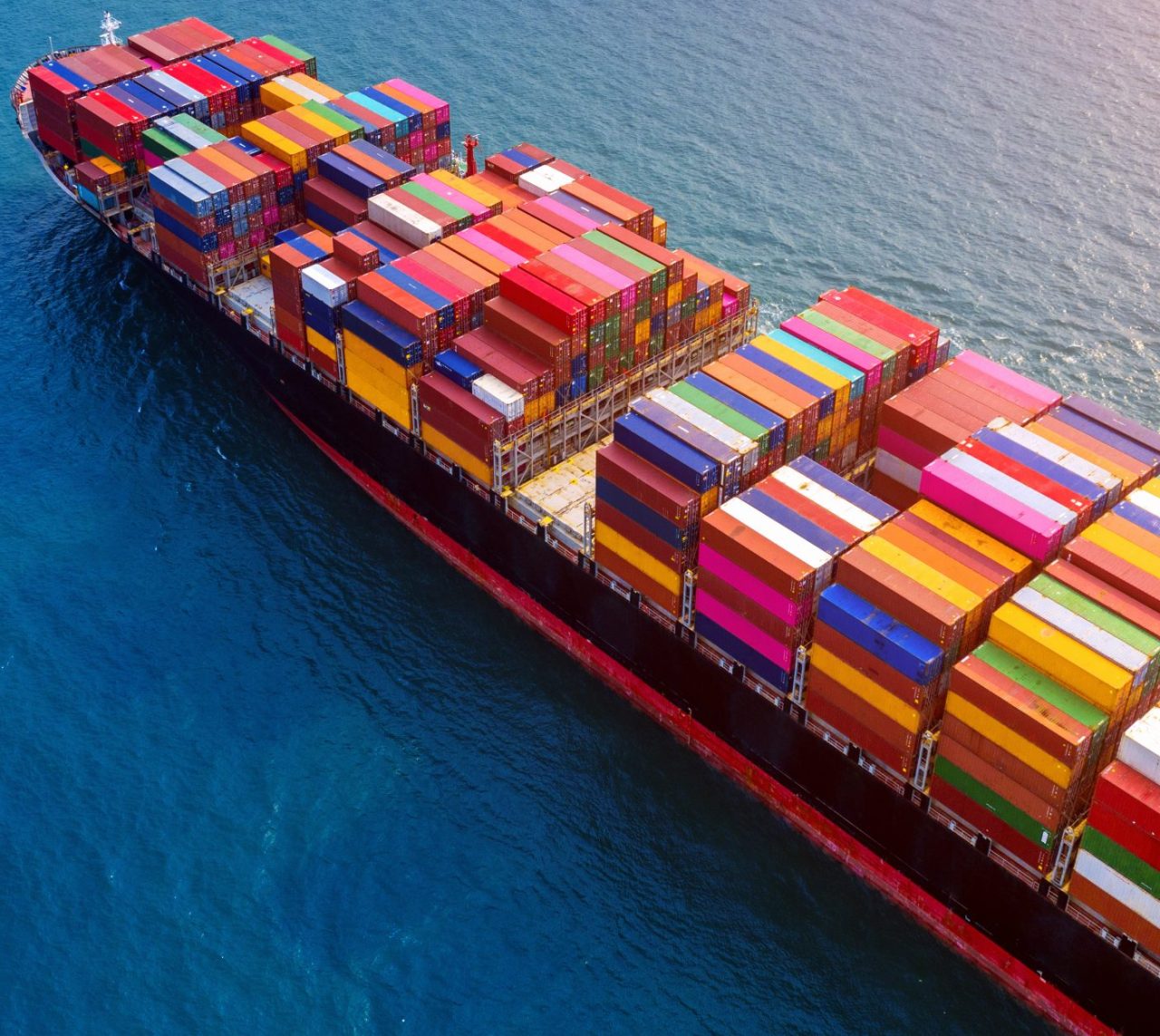 Aerial view of container cargo ship in sea.